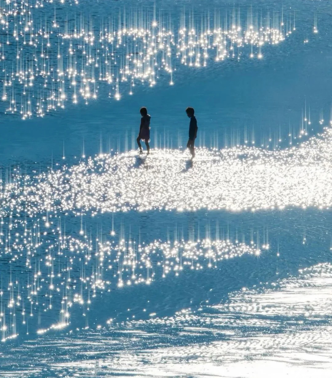 Figures walking on sparkling water